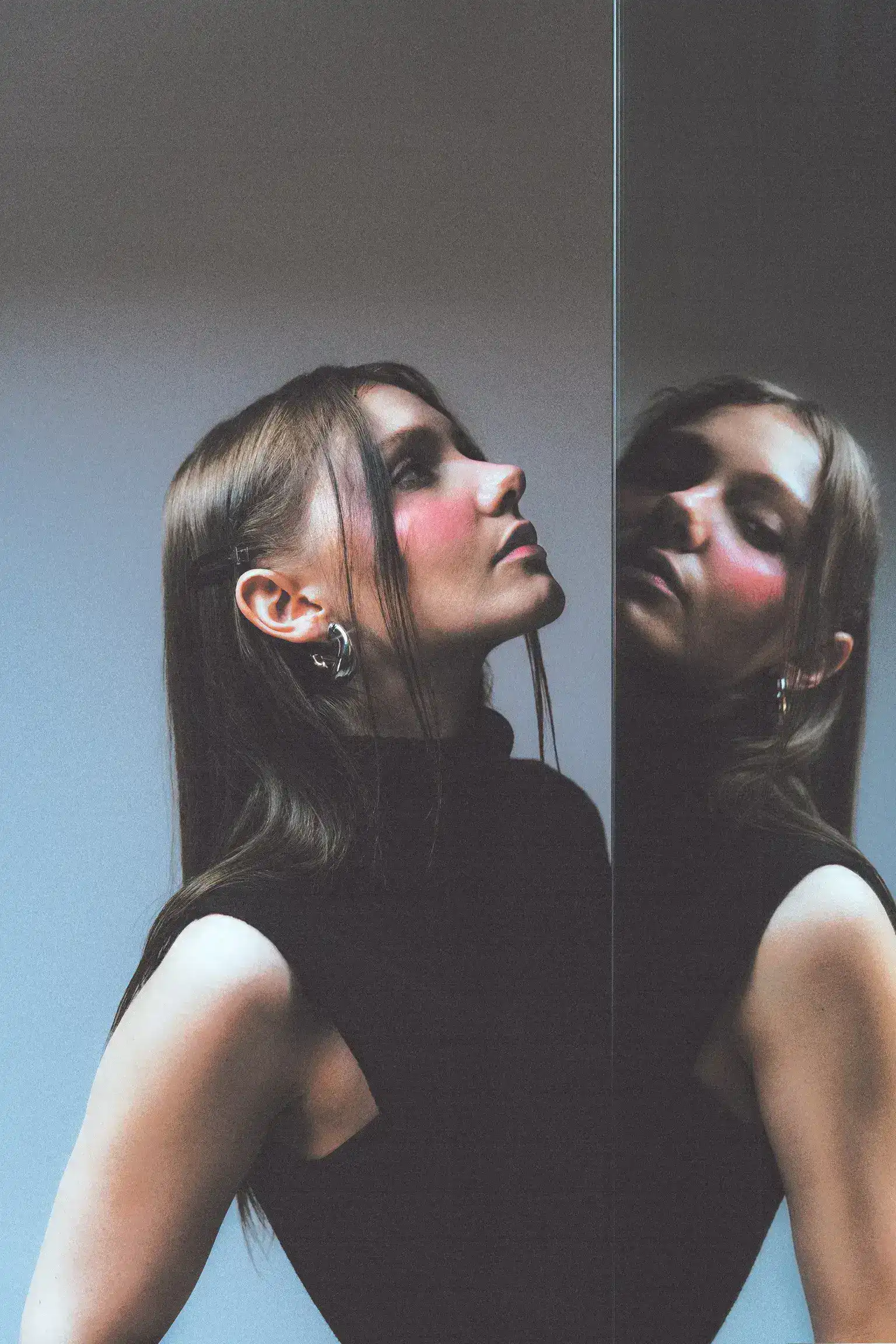 Marie L. framed inside a mirror reflection